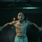 Man is working out in a gym.