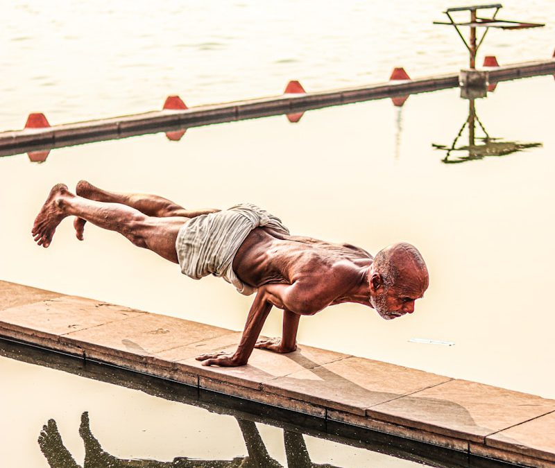 a person standing next to a body of water