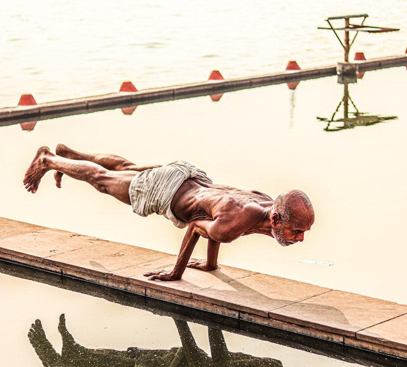 a person standing next to a body of water