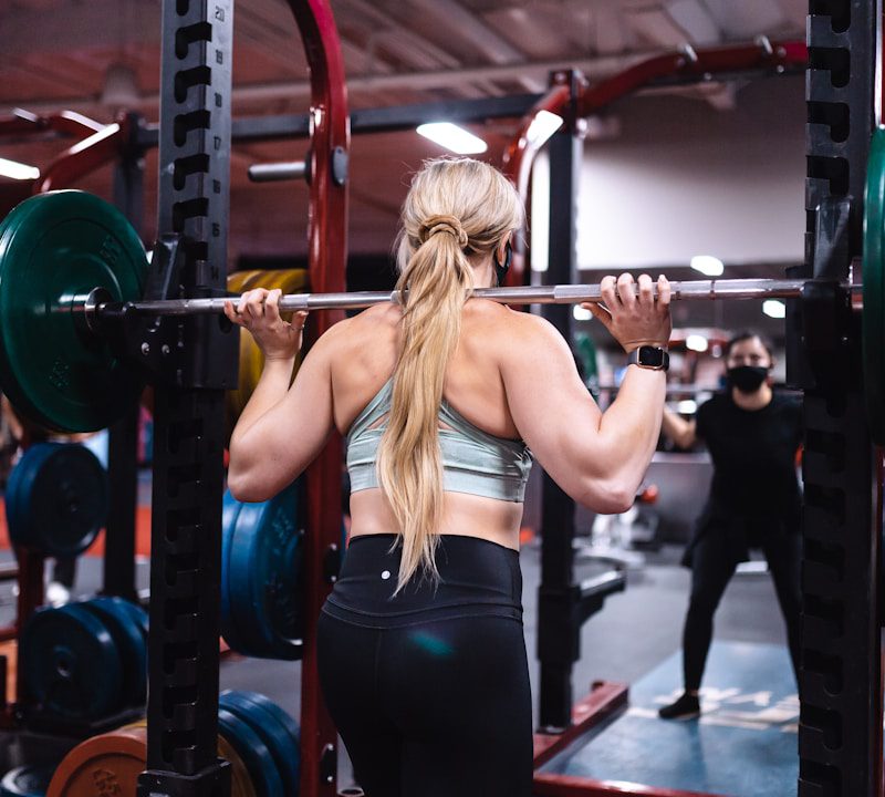 woman in black tank top and black leggings doing exercise