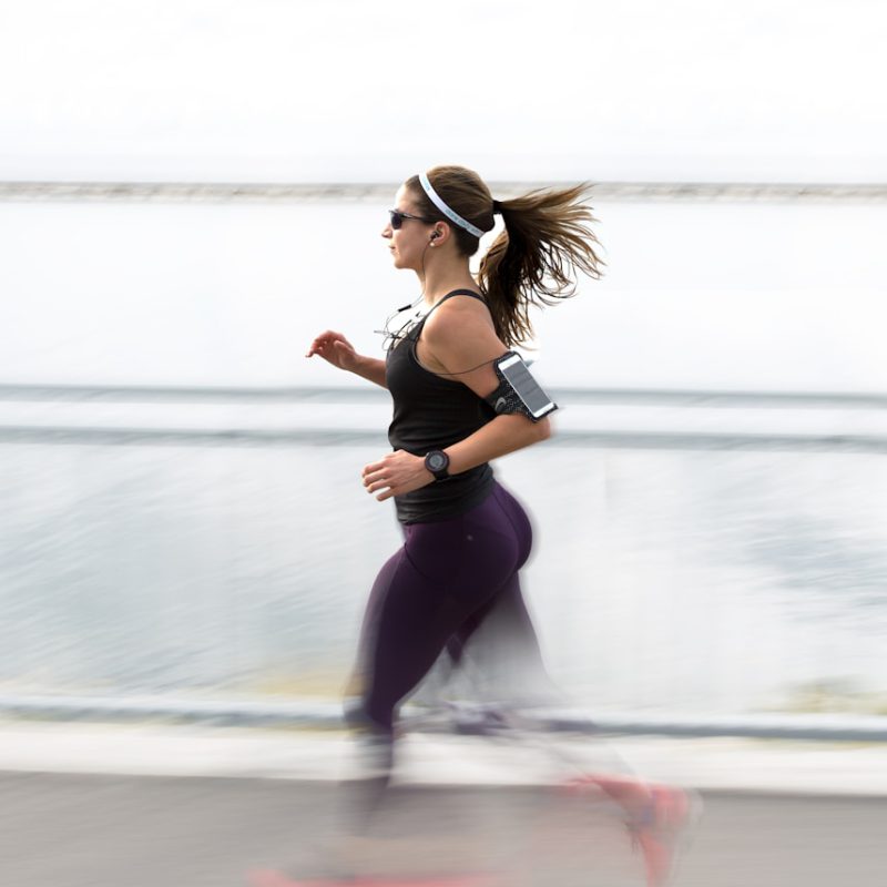 woman running wearing armband